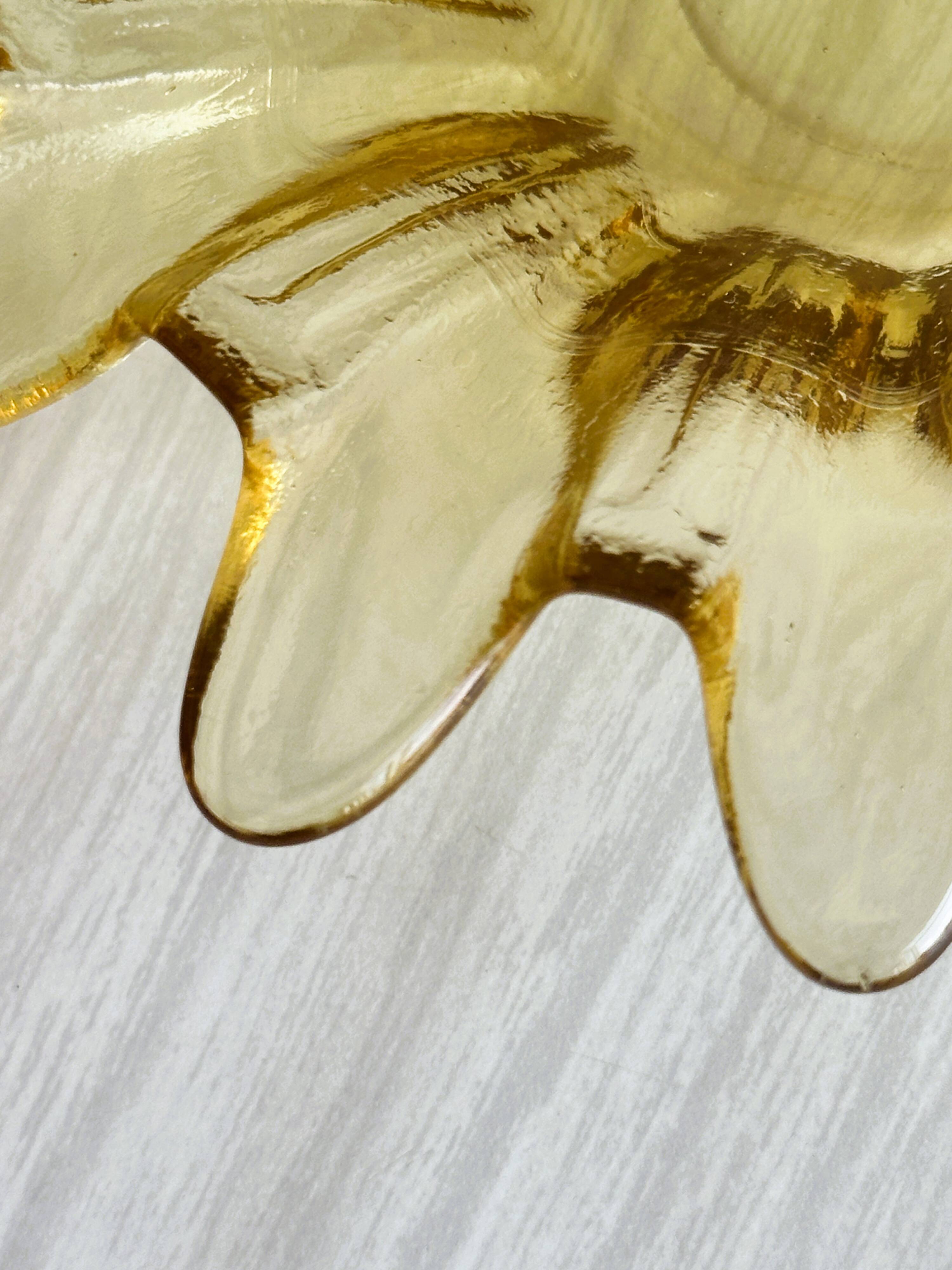 Yellow translucent blown glass pocket emptier