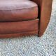 Paire de fauteuils club en cuir brun des années 30