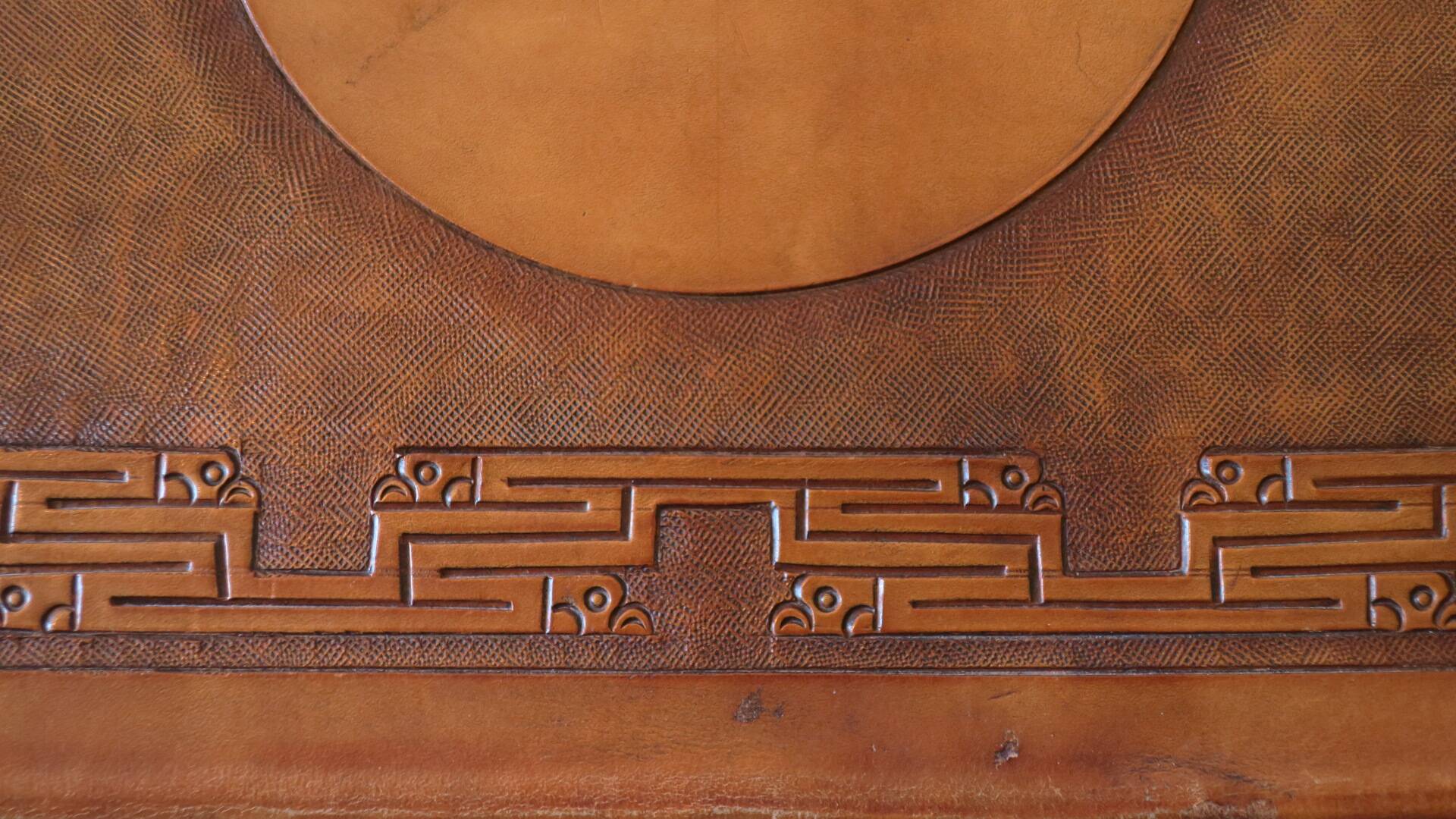 Tiahuanaco design tooled leather folding armchair by Angel Pazmino, Ecuador