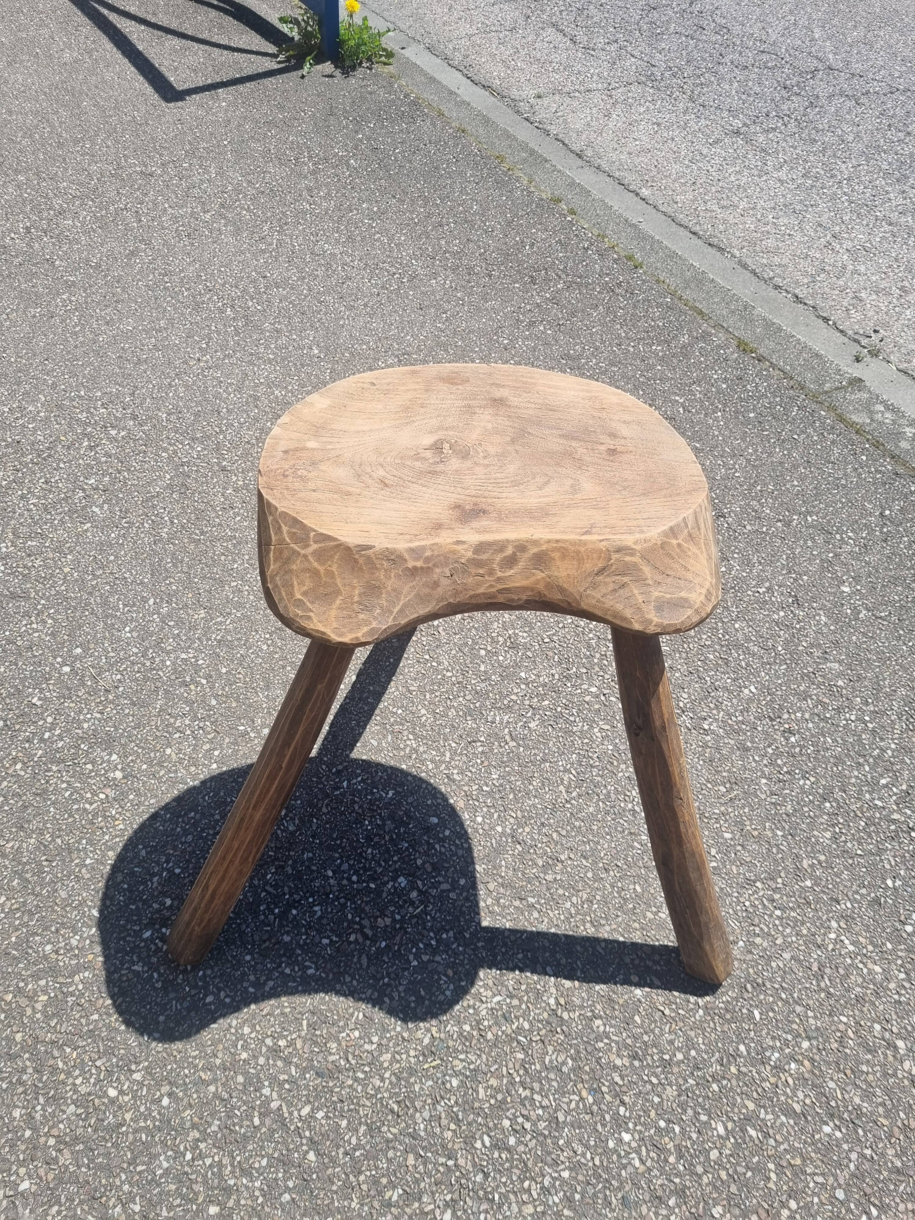 Old wooden tripod stool