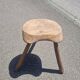 Old wooden tripod stool