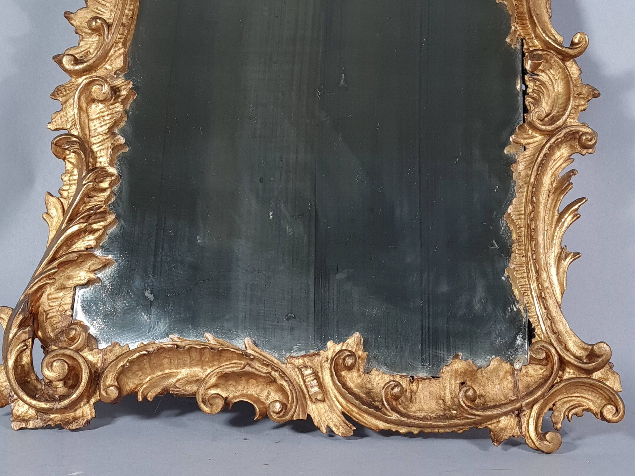 Mirror circa 1800, carved and gilded wooden frame, rocaille decoration, 54x39 cm, C227
