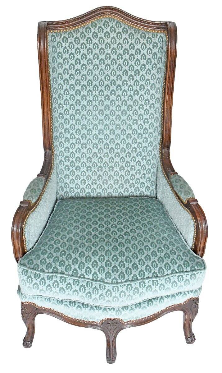 Pair of Louis XV style wingback armchairs with five legs.