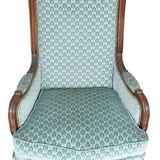 Pair of Louis XV style wingback armchairs with five legs.