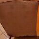 Pair of Art Deco armchairs in curved wood and brown leather – 1930s