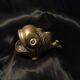 Empty pocket fish in gilded bronze