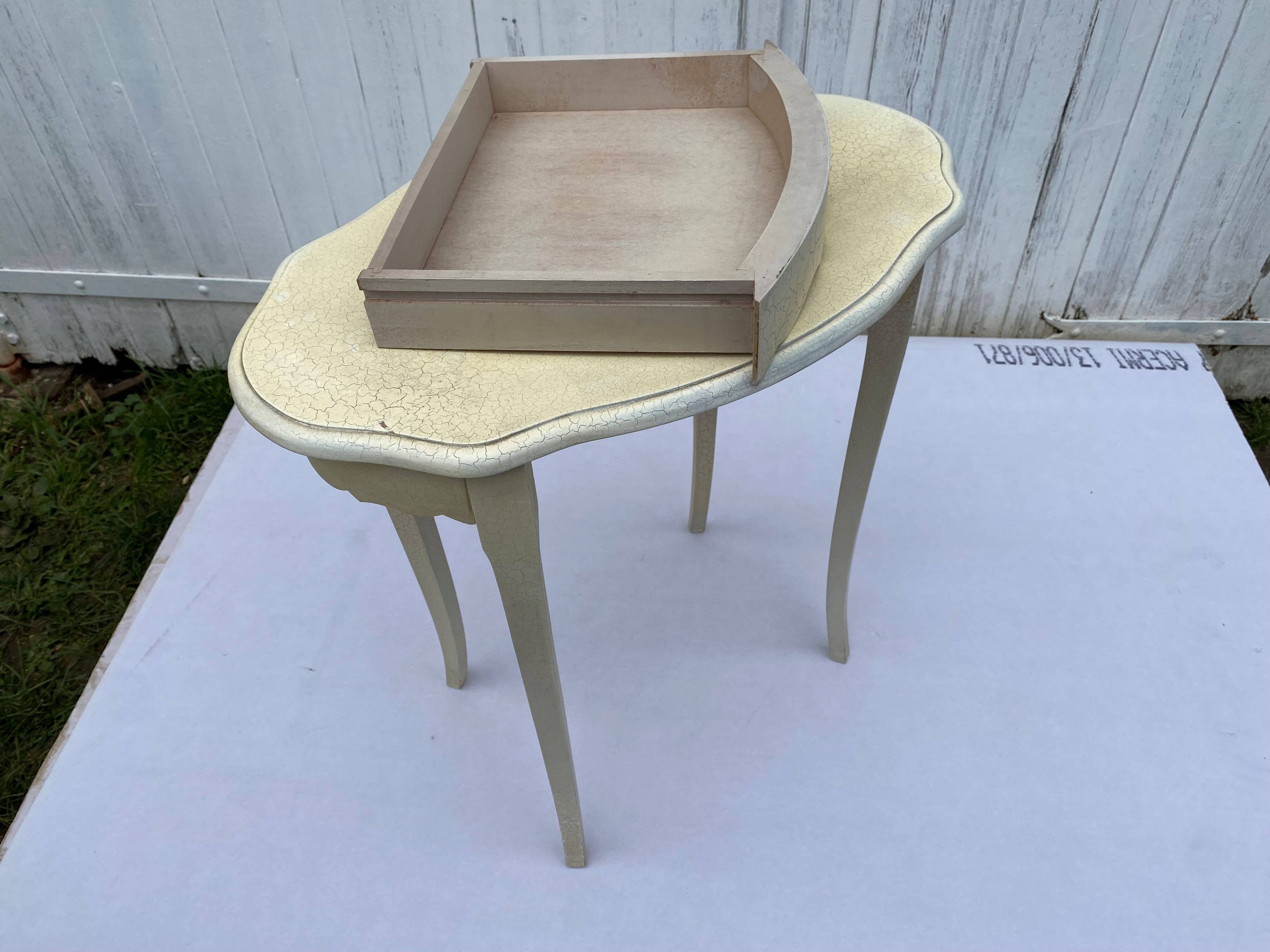 Eggshell-coloured drawer with a cracked effect side table.
