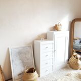 Old white asymmetrical chest of drawers