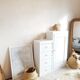 Old white asymmetrical chest of drawers