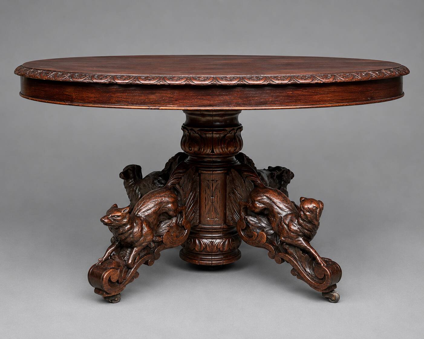 Hunting style dining table with figures of four different animals.