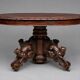 Hunting style dining table with figures of four different animals.