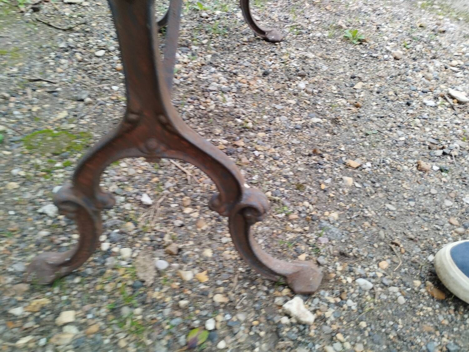 Antique bistro table with iron legs and wooden top