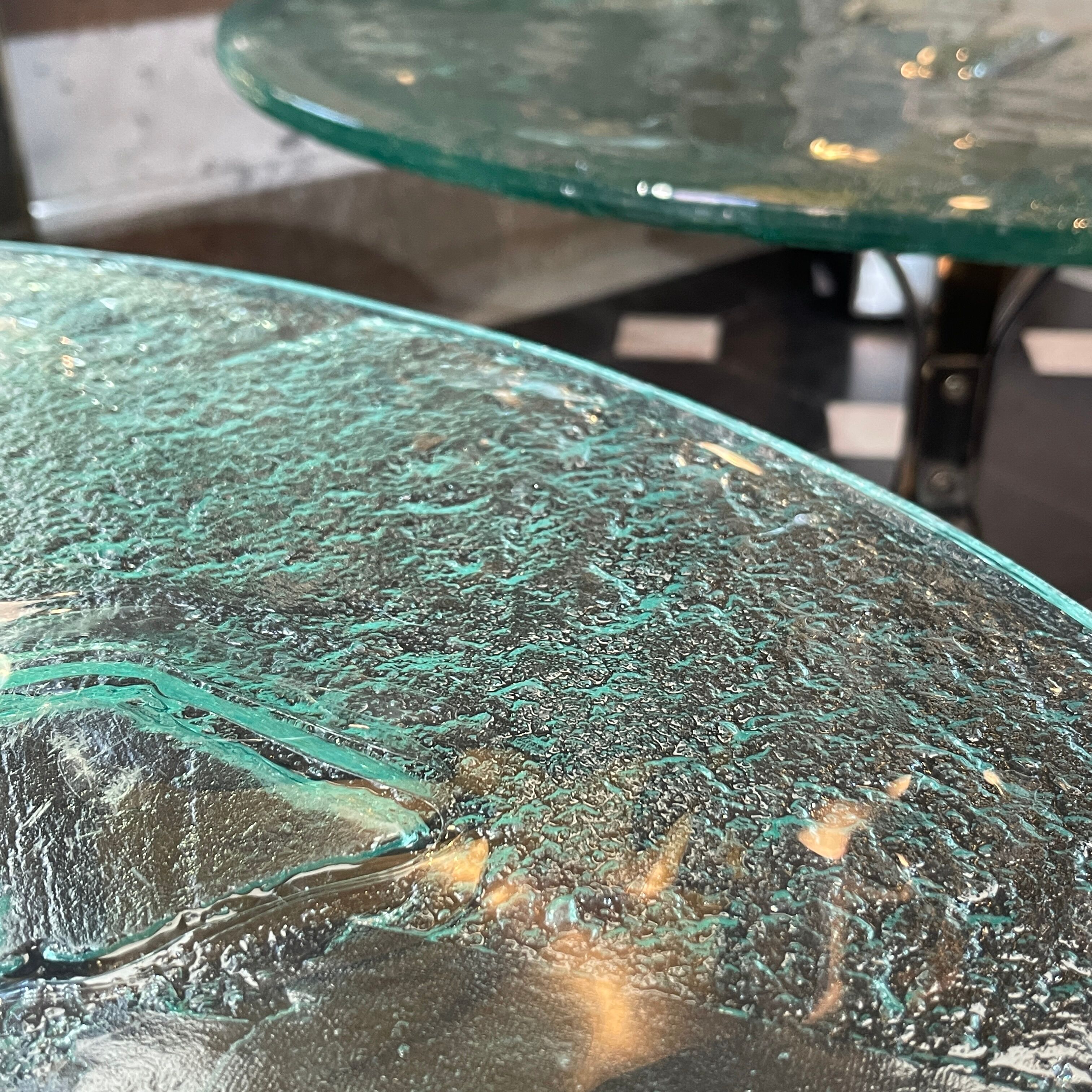 Pair of round coffee tables, glass, ca 1970