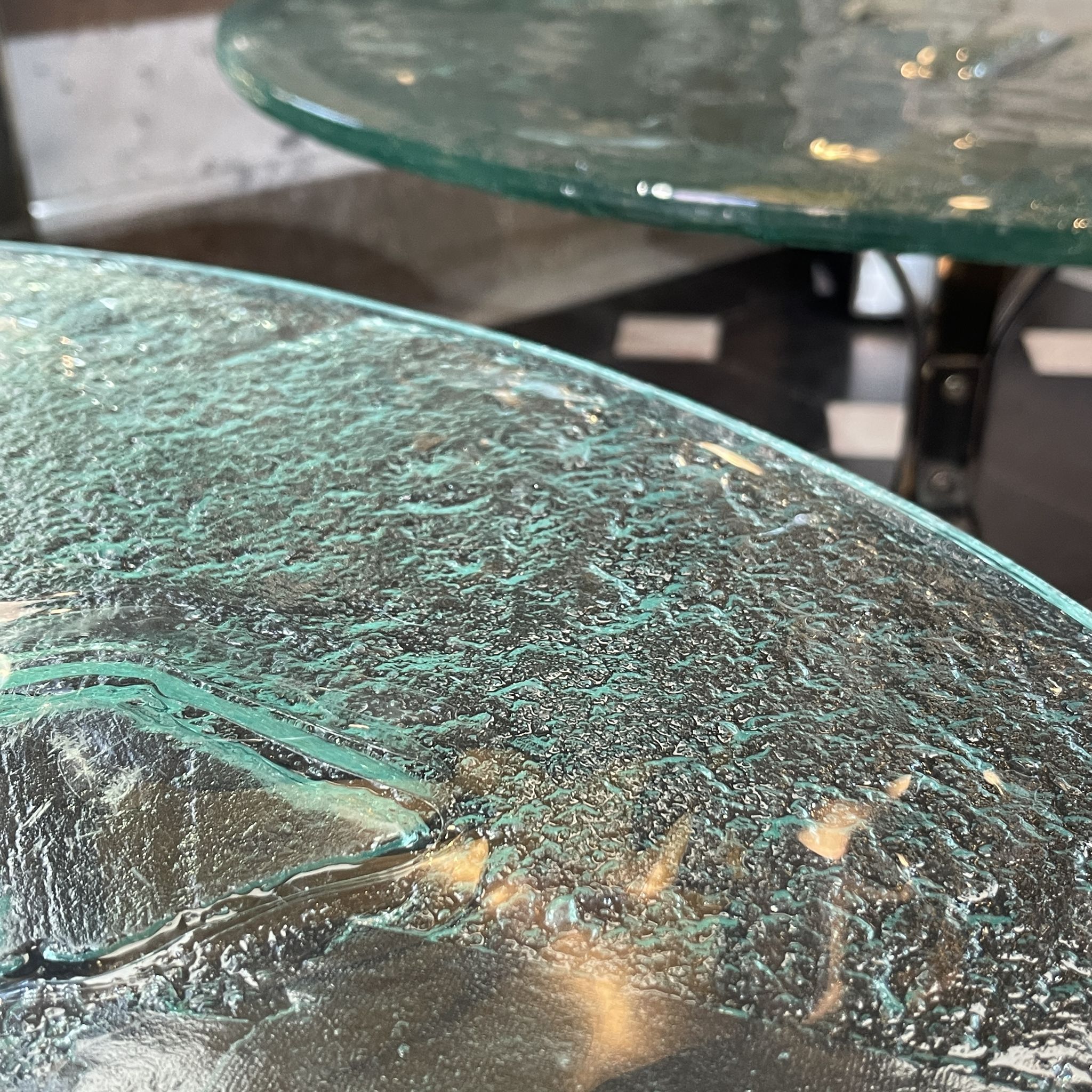 Pair of round coffee tables, glass, ca 1970