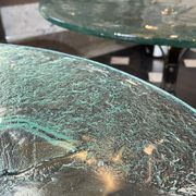 Pair of round coffee tables, glass, ca 1970