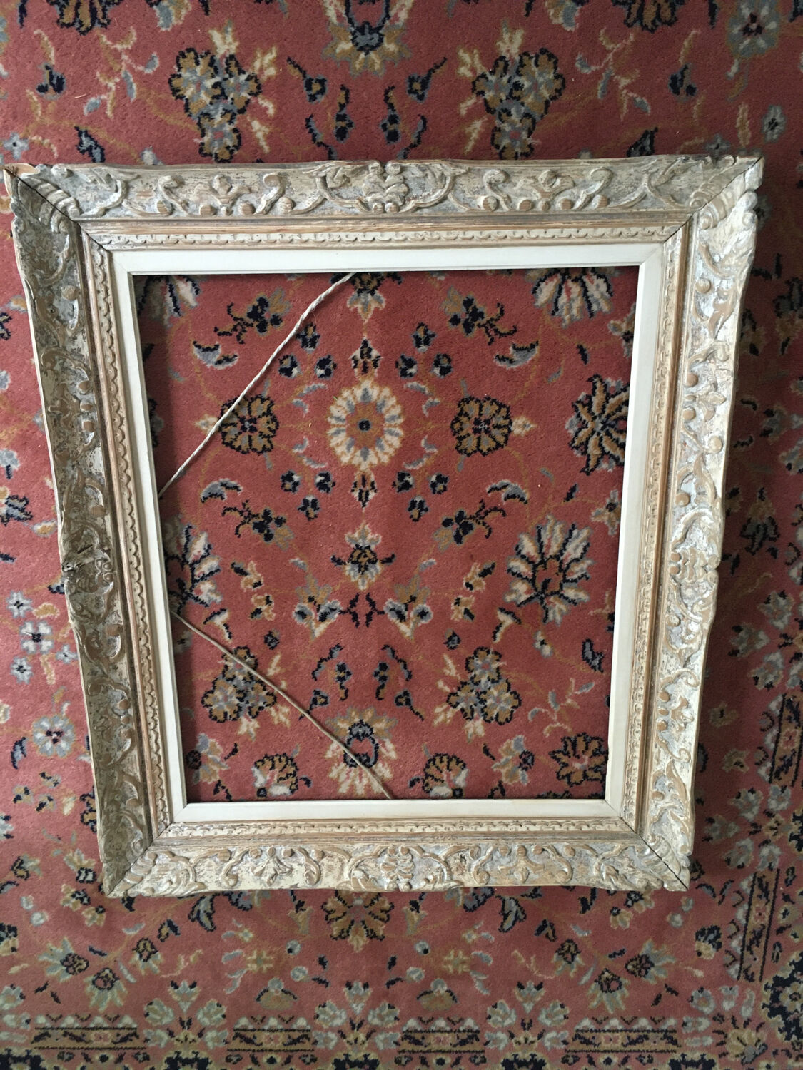 Carved wood frame.