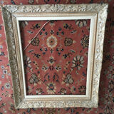 Carved wood frame.