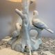 Ceramic lamp with birds, pink fringed shade, 1950s.