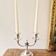 Pair of silver-plated metal candlesticks with 2 branches.