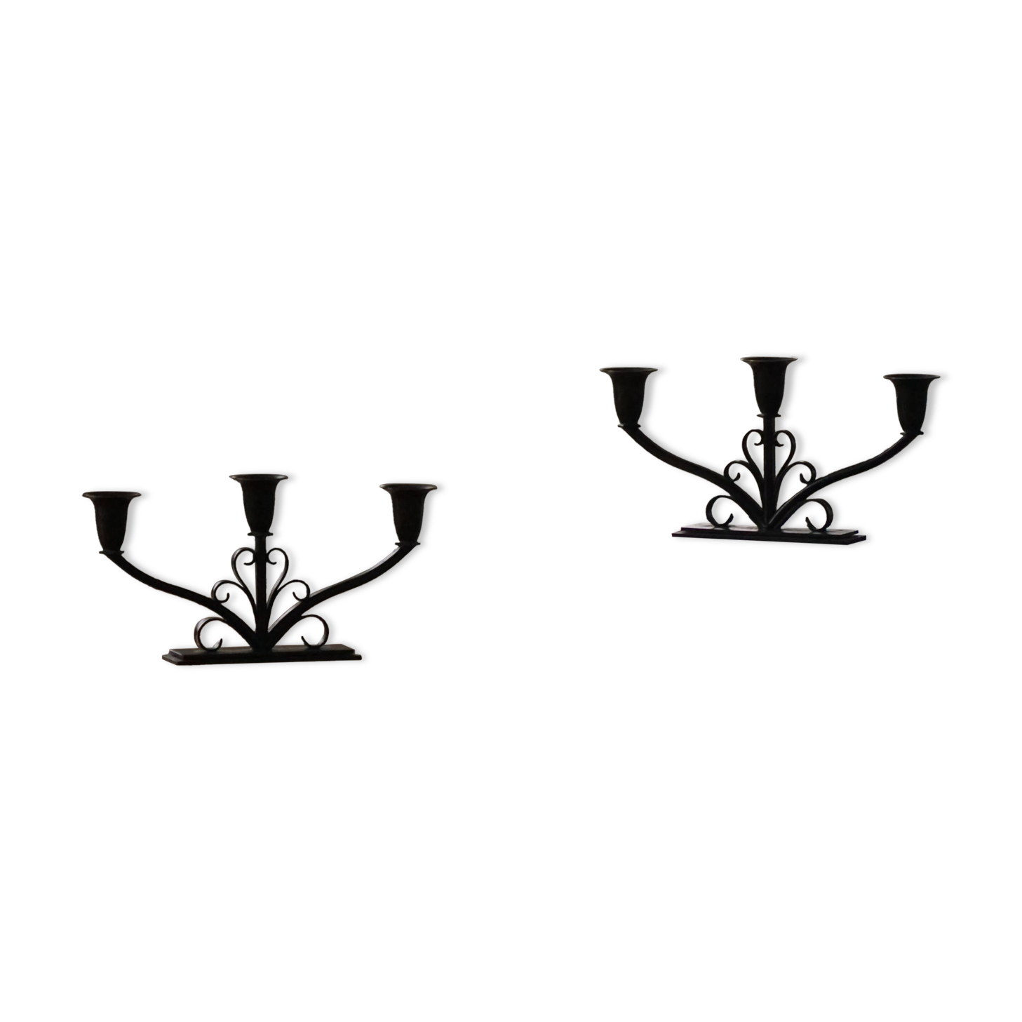 Early 20th century, pair of Danish Art Deco candlesticks in metal with three arms, 1930s.