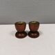 Two beautiful teak candle holders with brass inserts.