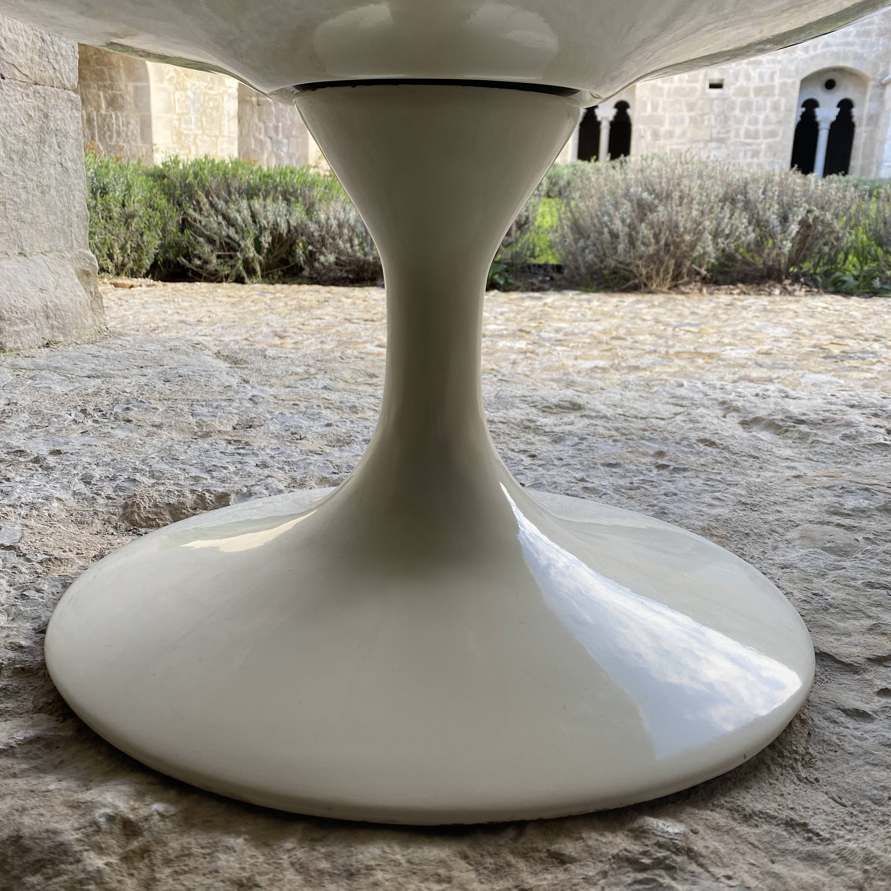 Two cognac-colored swivel chairs made of fiberglass from the 1970s