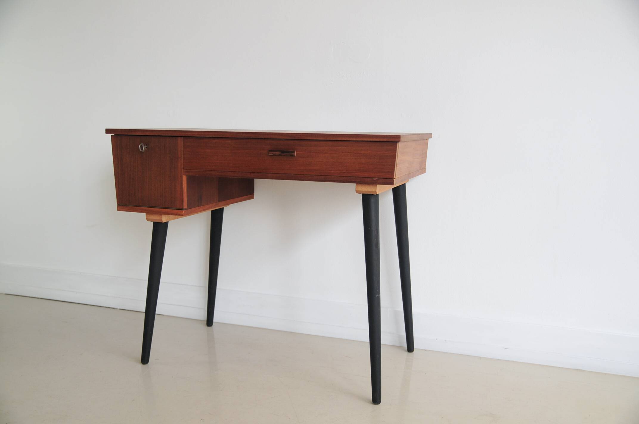 Vintage teak desk on black legs