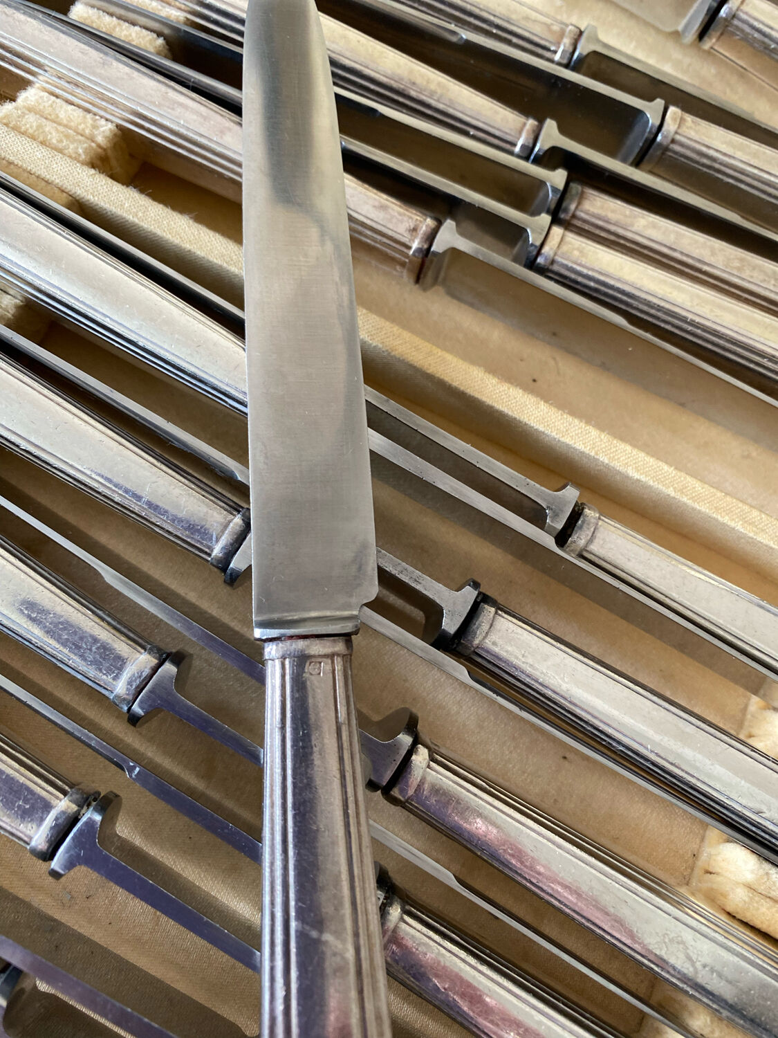 Box of silver metal knives