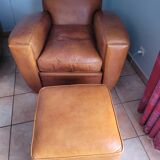 Leather club armchair and its pouf