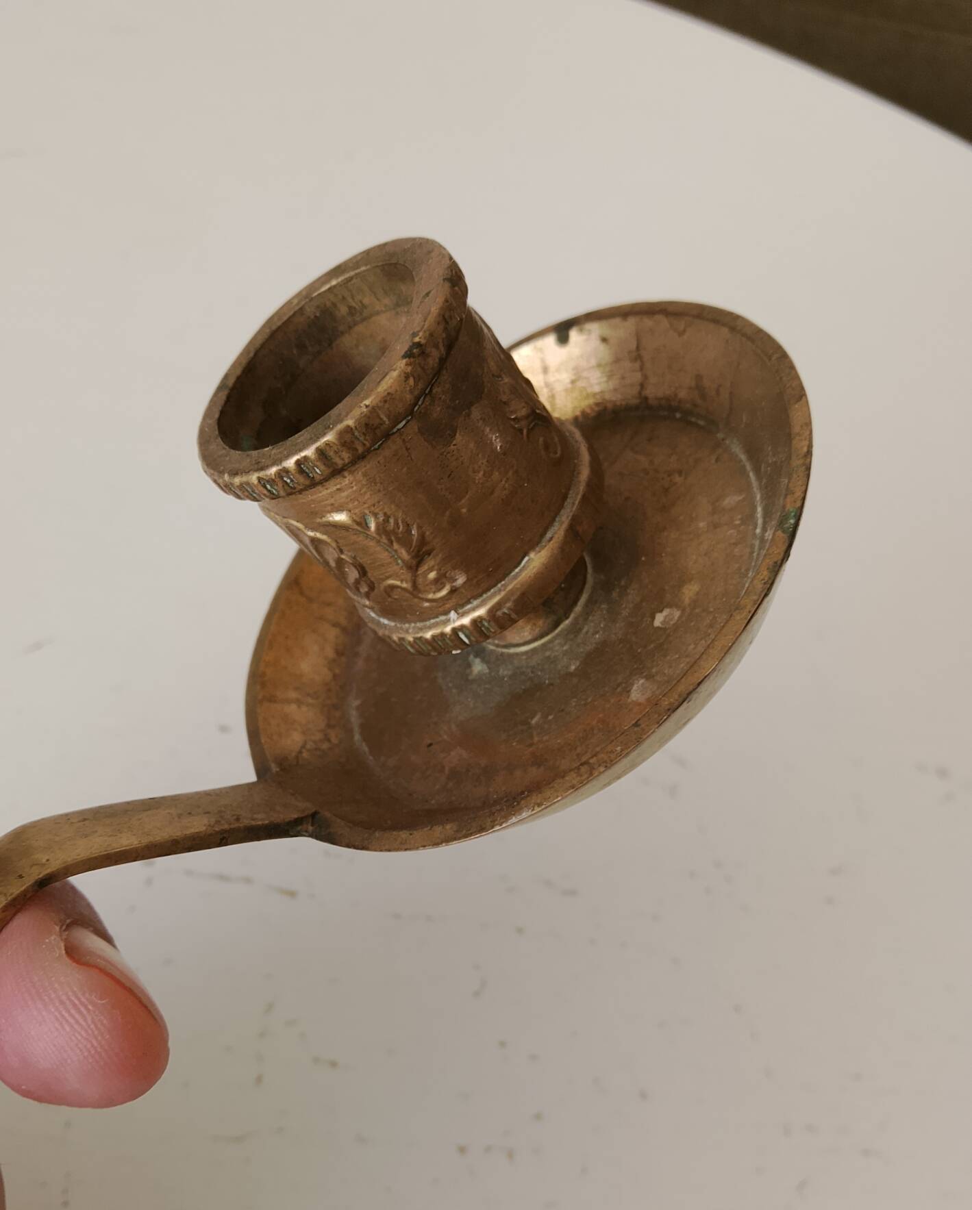 Antique hand-held candlestick in gilded bronze
