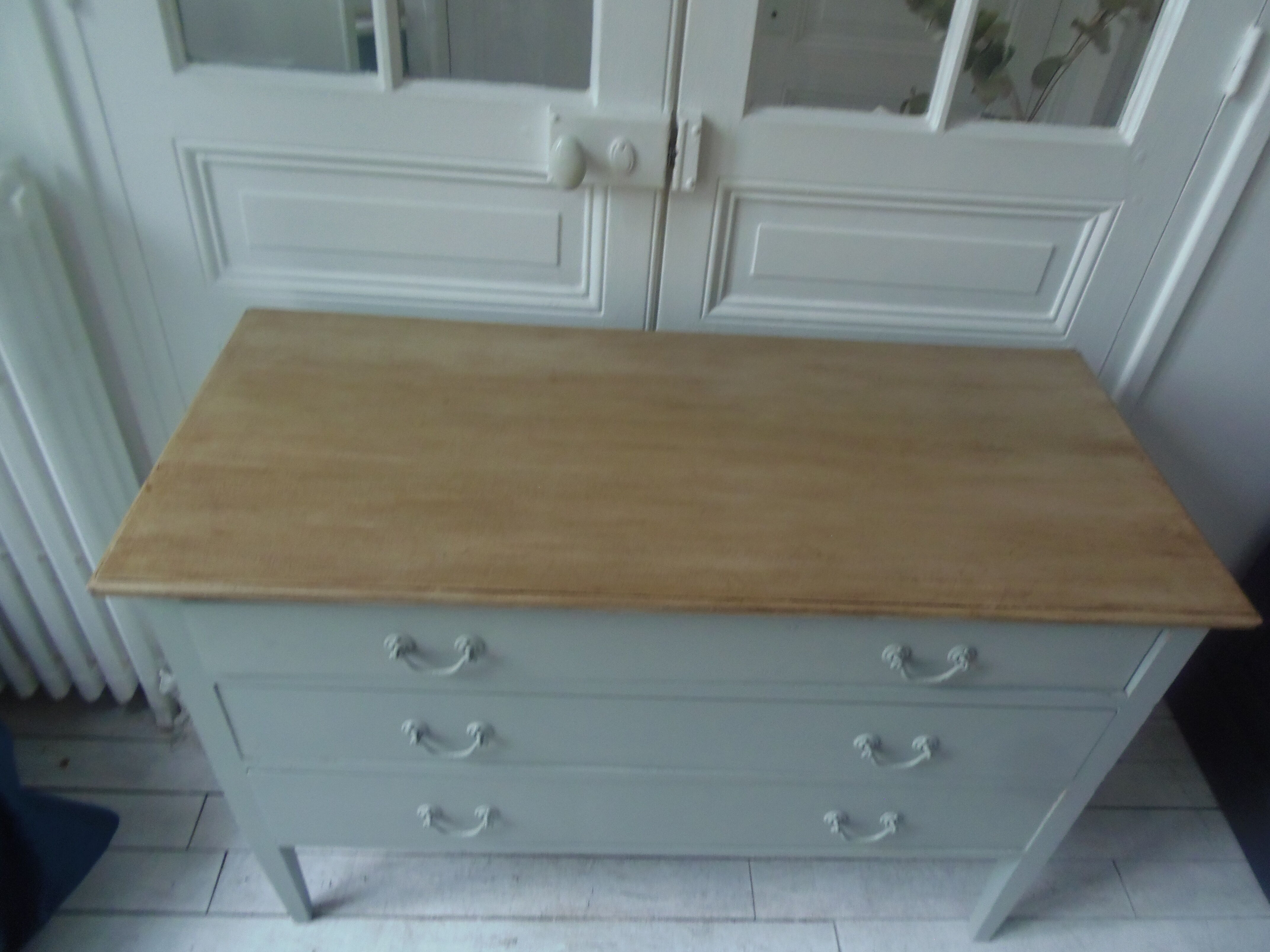 Green green vintage chest of drawers of gray, wood top.