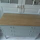 Green green vintage chest of drawers of gray, wood top.