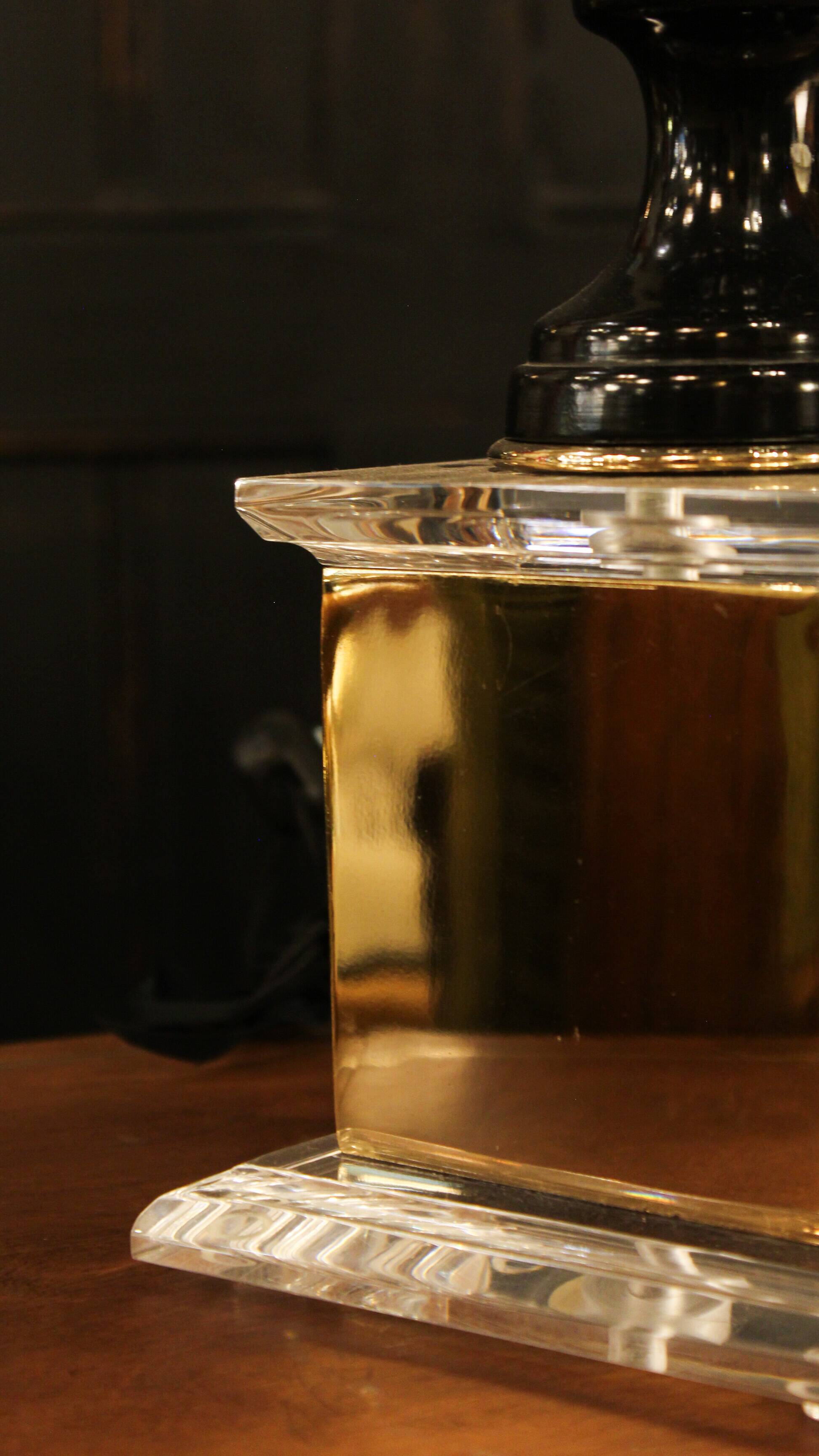 Black lamp in Hollywood Regency style