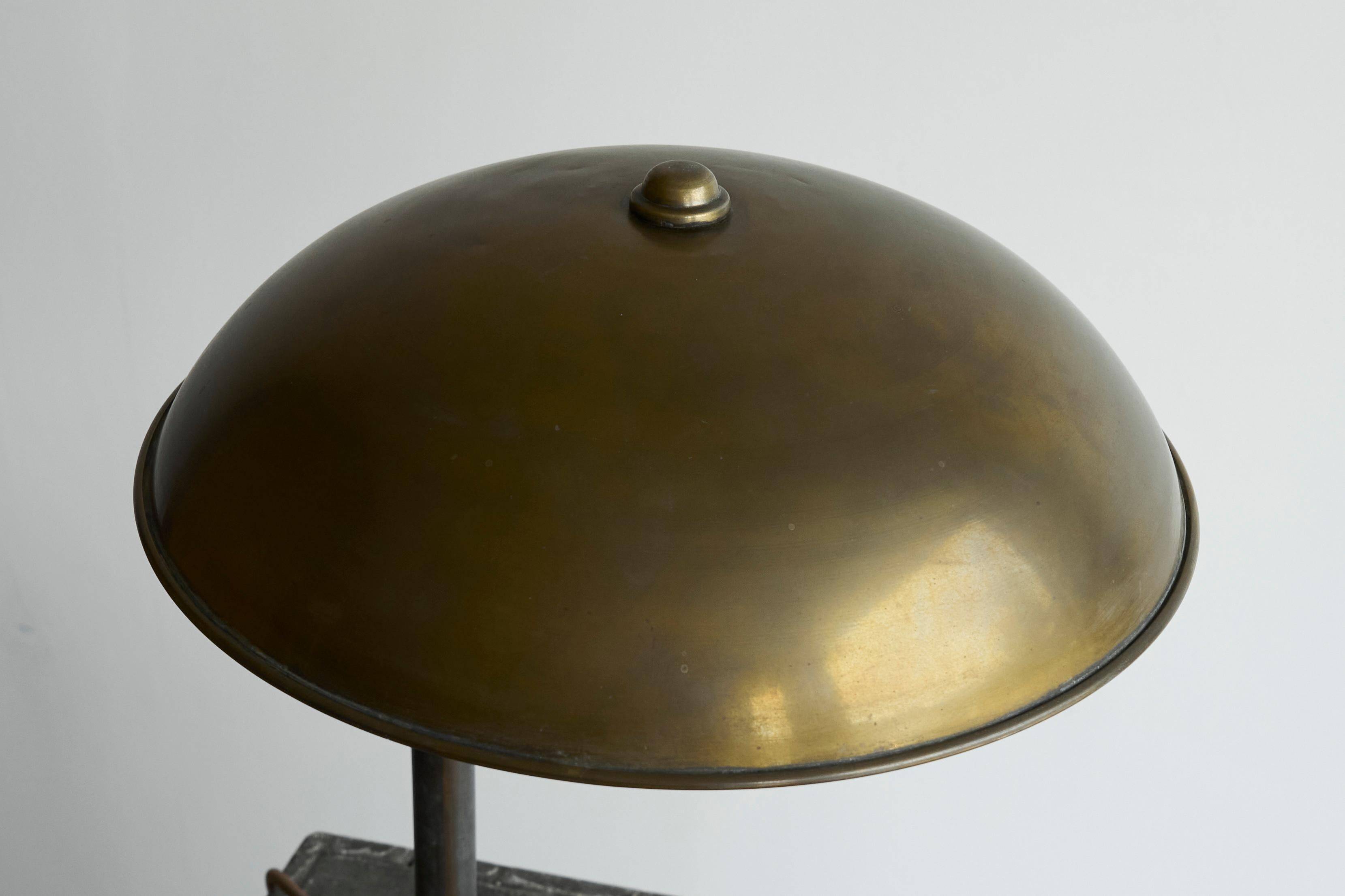 Bauhaus style table lamp in patinated brass from the 1930s.
