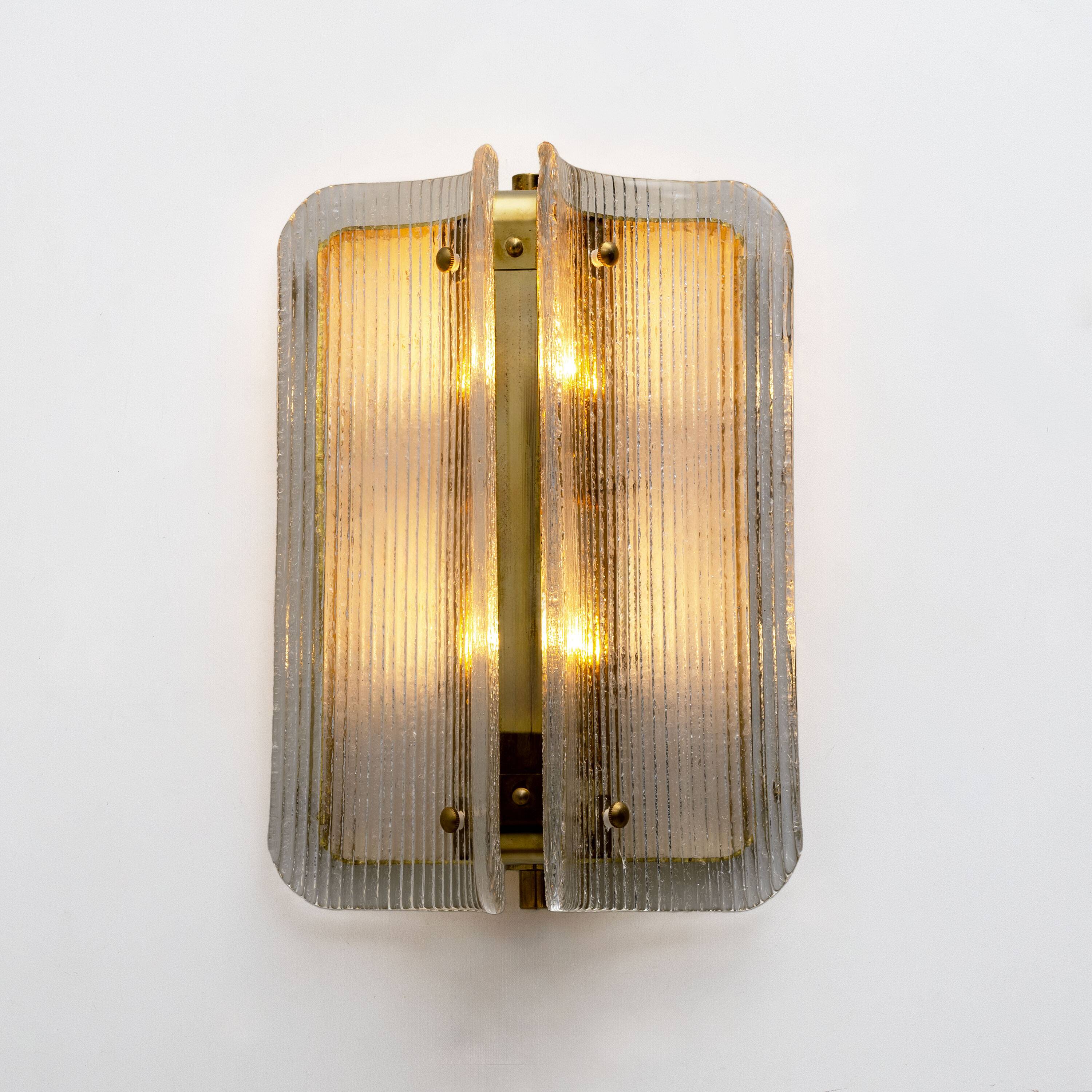 Pair of Curved Clear Ribbed Murano Glass and Brass Wall Sconces