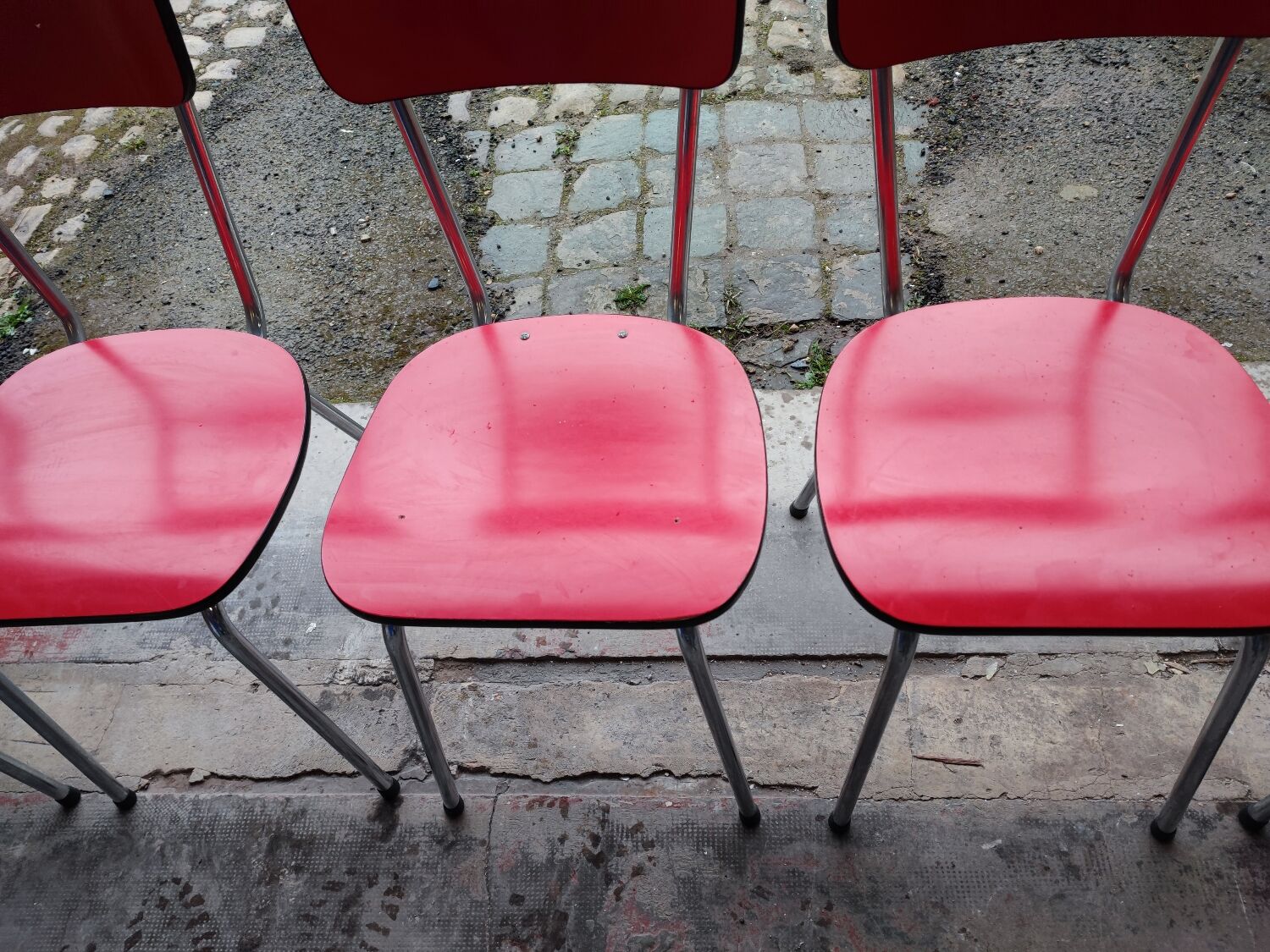6 red and chrome Formica chairs