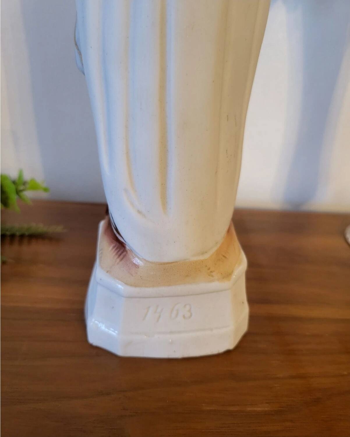 Religious statuette of the Virgin Mary in bisque porcelain