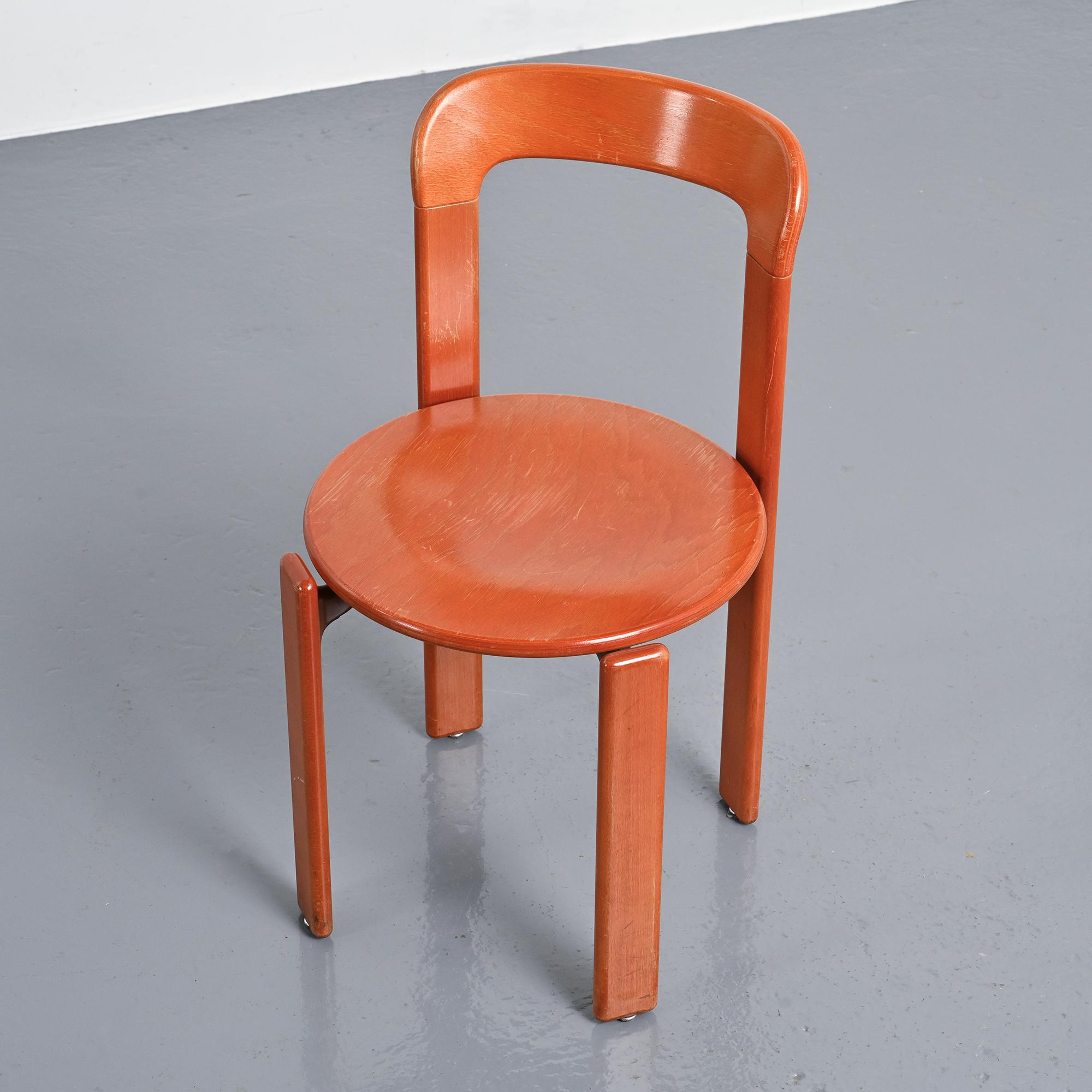 Rey chairs in stained red beech by Bruno Rey