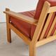 Brutalist armchair in oak and leather by Tage Poulsen, Denmark, 1970s.
