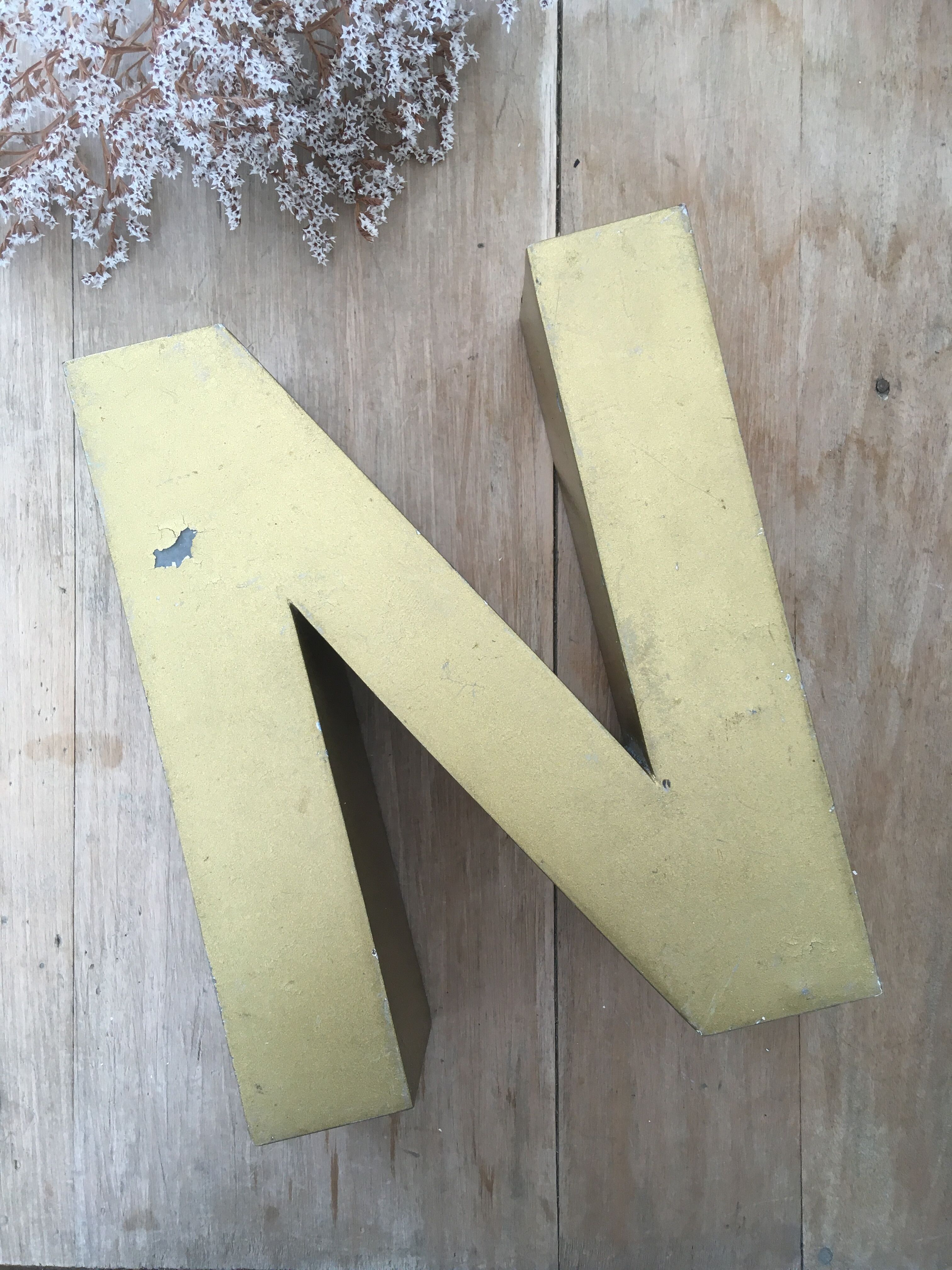 Golden vintage sign letter N