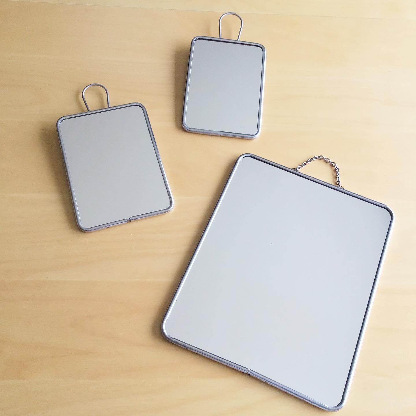 Set of three vintage barber mirrors