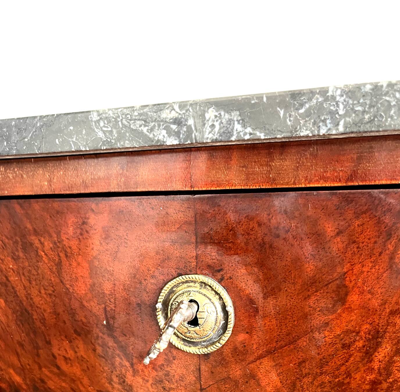 Louis XVI style wooden veneered chest of drawers with a marble top.