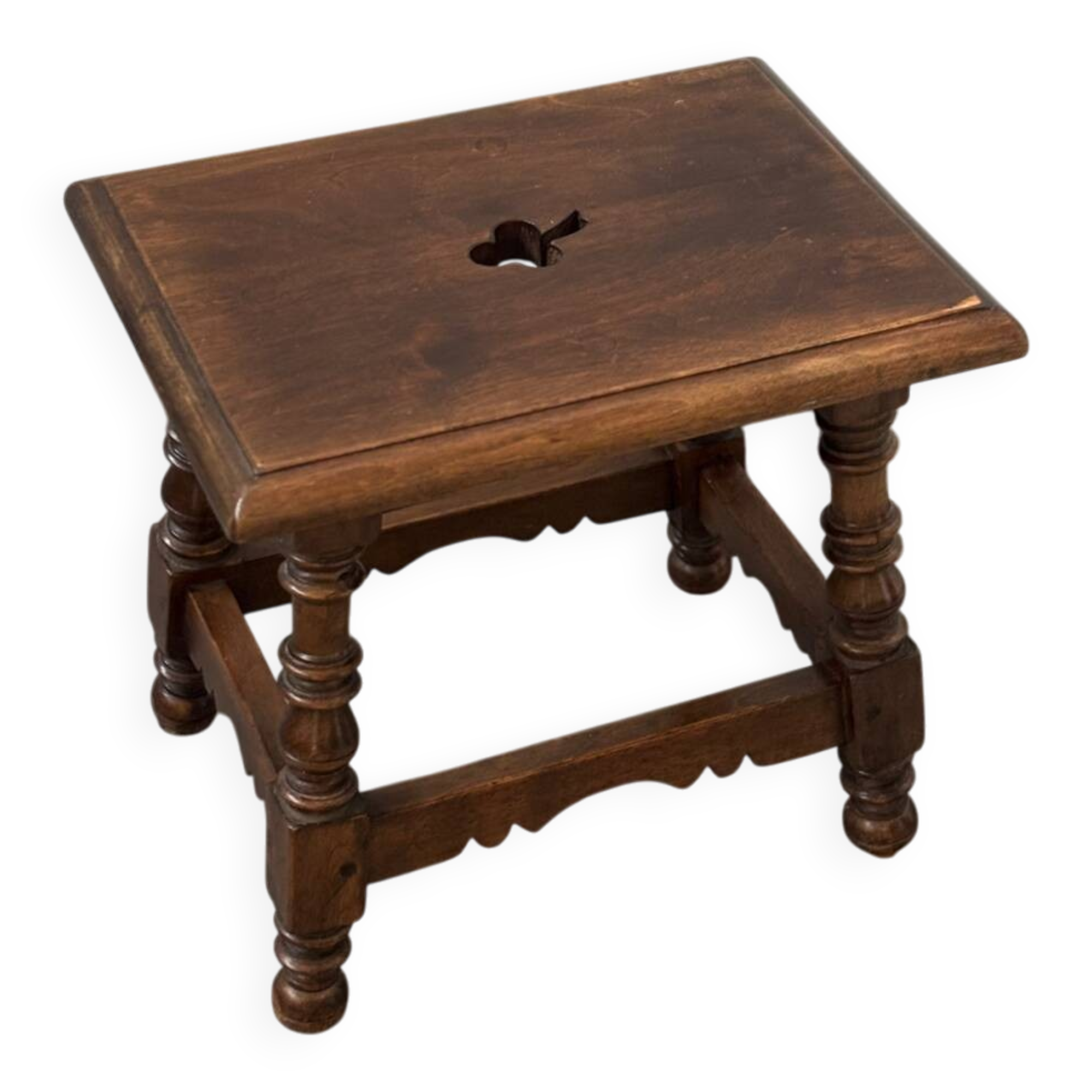 Small antique wooden stool with an openwork pattern.