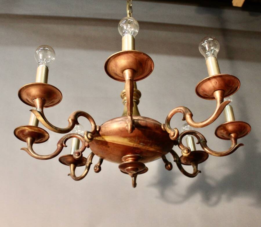 Bronze chandelier with double patina and 8 light arms.