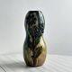 Very colorful glazed earthenware vase, old vase with floral decoration.