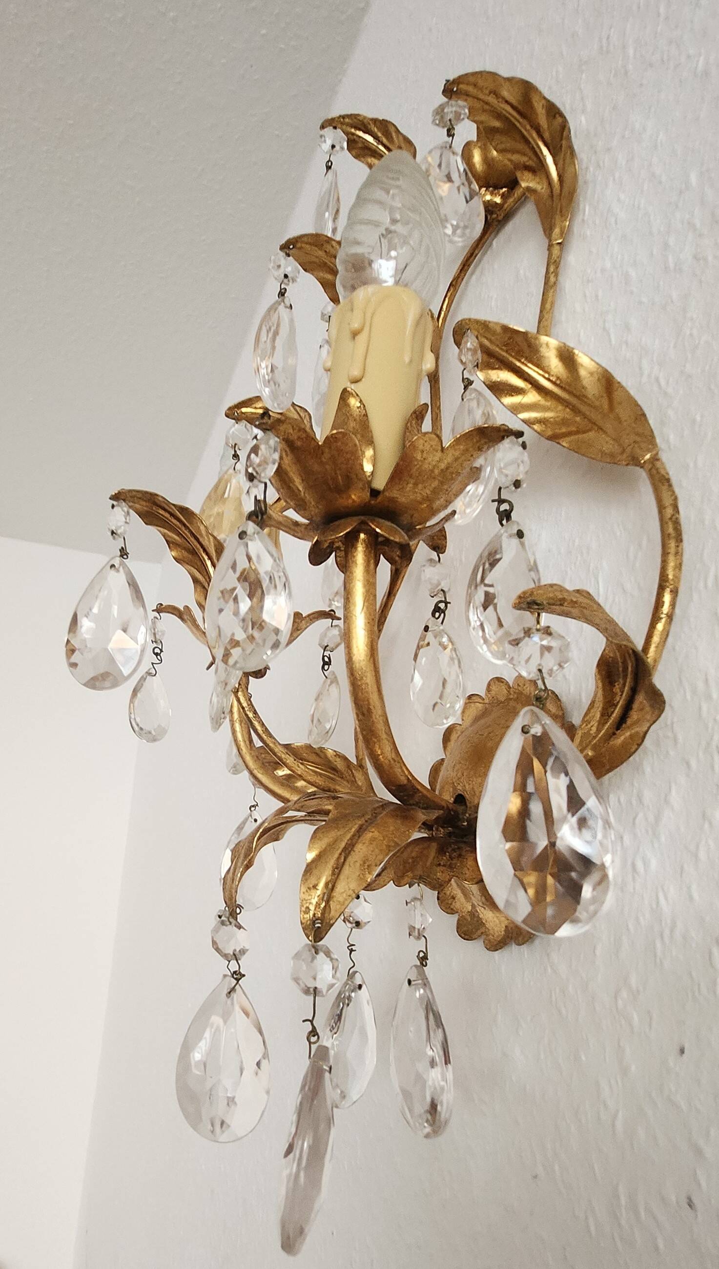 Hand-forged wall lamp gilded with gold leaf and crystals, Italy