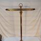 Old golden brass towel rack on baroque style foot