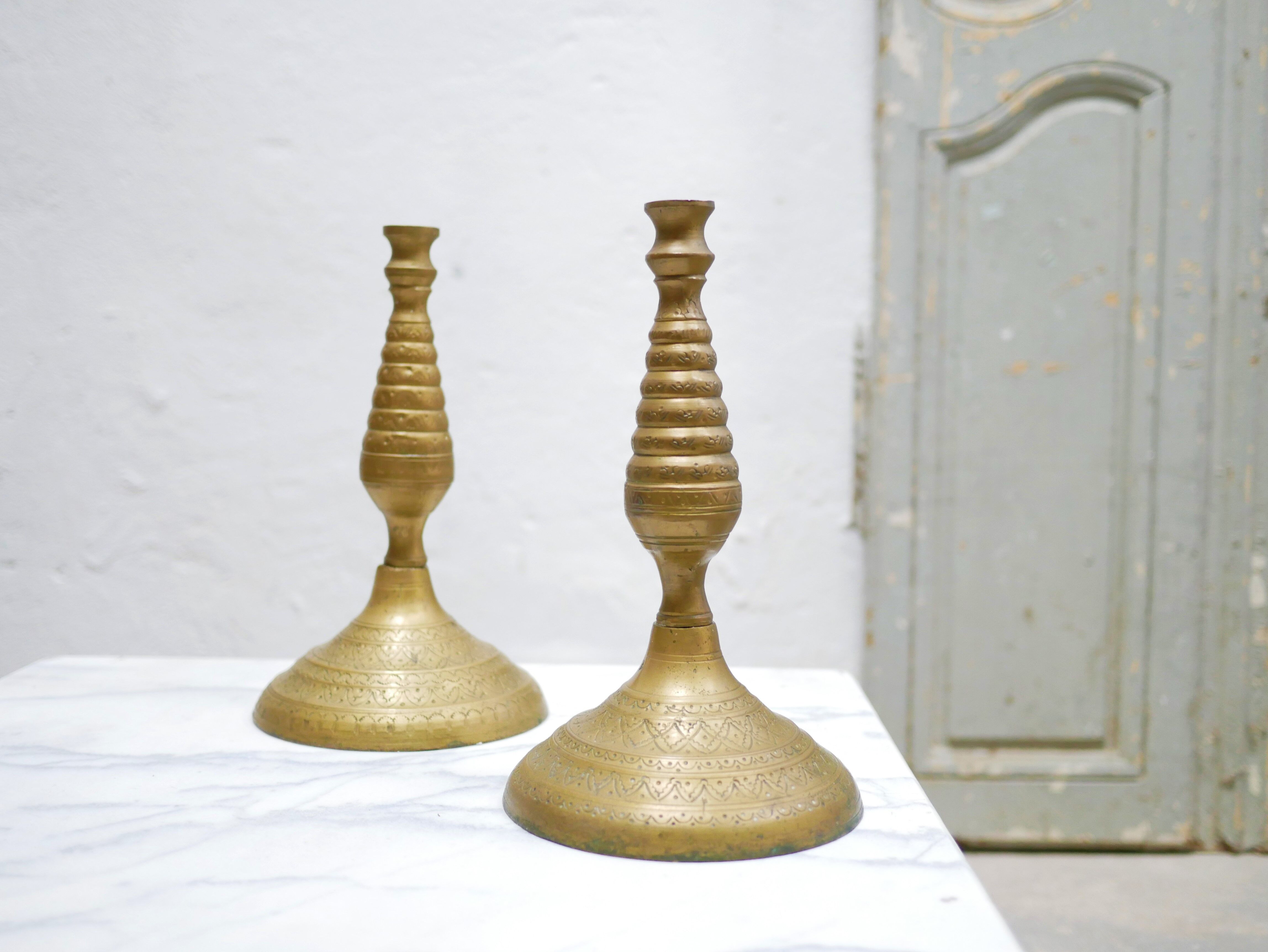 Pair of vintage candle holders in golden brass