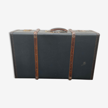 Old suitcase with wooden reinforcements