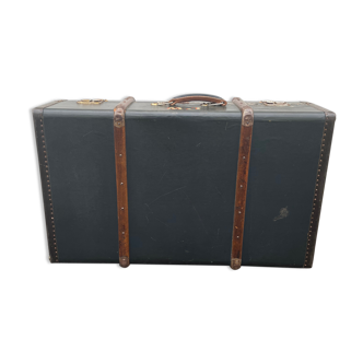 Old suitcase with wooden reinforcements